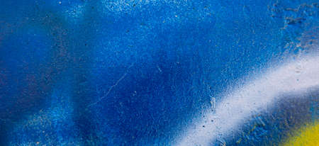 Fragment of the wall with graffiti painting. Part of colorful street art graffiti on wall backgroundの写真素材