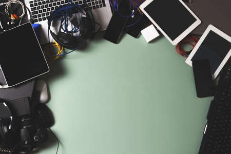 Top view to old laptop computers, digital tablets, mobile phones, many used electronic gadgets...