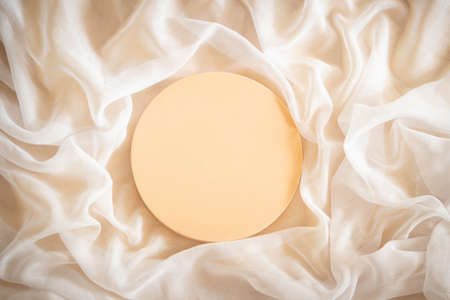 Round geometric platform podium stand for cosmetics product presentation on smooth elegant white transparent cloth fabric background. Top viewの写真素材