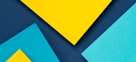 Abstract color papers geometry flat lay composition banner background with blue and yellow tonesの写真素材