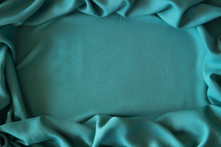 Abstract linen blend wavy fabric texture background. Crumpled green hue dyed linen textiles canvas...