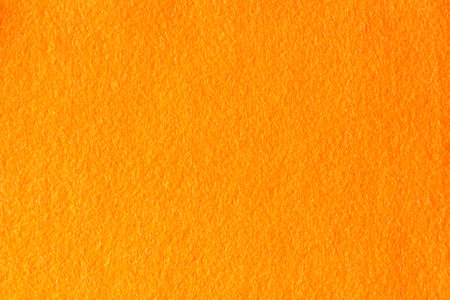 Orange hue color felt textile fabric texture backgroundの写真素材