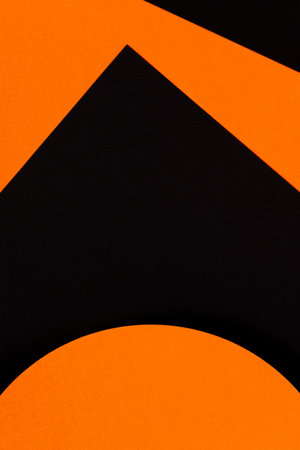 Abstract geometry paper texture background. Shape and lines in black and orange colors. Top viewの写真素材