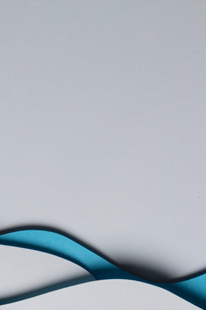 Abstract colored paper texture background. Minimal paper cut style composition with layers of geometric shapes and lines in blue hue colors. Top viewの写真素材