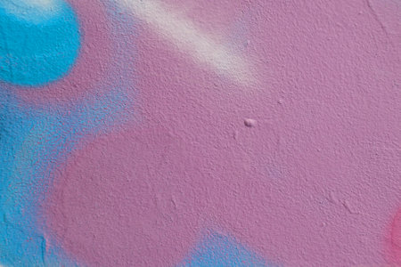 Fragment of old plaster wall with graffiti painting. Part of colorful street art graffiti on wall...