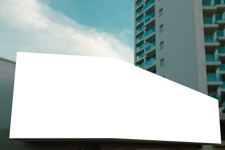 Blank white big mockup advertising sign above entrance of shop, hotel, office building. Empty banner mock up template outdoorsの写真素材