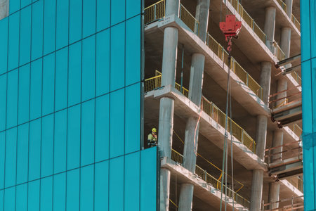 Vilnius, Lithuania - October 31, 2022: Construction of new modern building. Construction worker and...