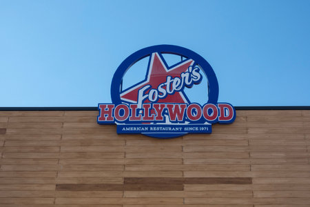 Finestrat, Spain - March 2, 2023: Fosters Hollywood logo sign on Fosters Hollywood restaurant wall...