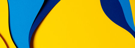 Abstract colored paper texture background. Minimal paper cut composition with layers of geometric shapes and lines in light blue, navy blue, yellow colorsの写真素材