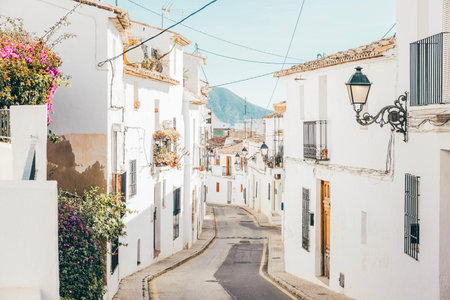 Altea old town with narrow streets and whitewashed houses. Architecture in small picturesque village of Altea near Mediterranean sea, Alicante province, Valencian Community, Spainの写真素材