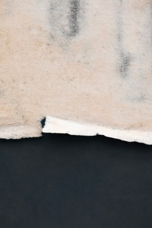 Old grunge torn collage urban street posters creased crumpled paper placard texture background. Ripped faded paper backdrop surface placardの写真素材