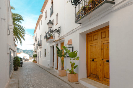 Altea old town with narrow streets and whitewashed houses. Architecture in small picturesque village of Altea near Mediterranean sea, Alicante province, Valencian Community, Spainの写真素材
