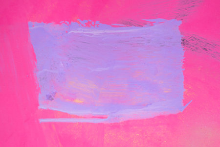 Messy paint strokes and smudges on an old painted wall background. Abstract wall surface with part of graffiti. Colorful drips, flows, streaks of paint and paint spraysの写真素材