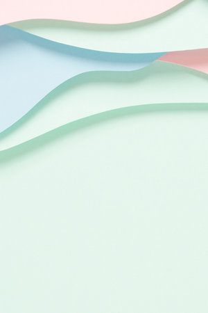 Abstract colored paper texture background. Minimal paper cut composition with layers of geometric shapes and lines in pastel green, pink and light blue colors. Top view, copy spaceの写真素材