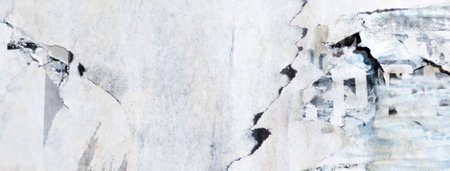 Old grunge torn collage urban street posters creased crumpled paper placard texture background. Ripped faded paper backdrop surface placardの写真素材