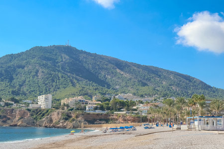 View to beautiful Albir town with main boulevard promenade, seaside beach and Mediterranean sea. Albir is small resort between Altea and Benidorm, LAlfas del Pi municipality, Alicante province, Spainの写真素材