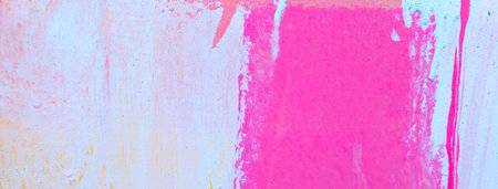 Messy paint strokes and smudges on an old painted wall. Colorful drips, flows, streaks of paint and paint spraysの写真素材