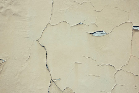 Abstract grunge wall background. Old plastered wall with many cracks. Grungy texture with deep...