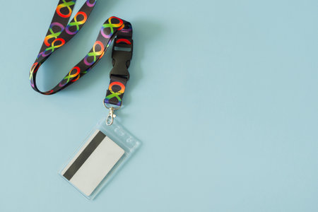 Black neck strap lanyard with infinity symbols on light blue background. Infinity is symbol of...