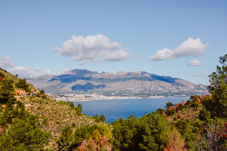 Serra Gelada natural park, Altea, Sierra de Bernia mountain and Mediterranean Sea in sunny day. View from trip road to Albir lighthouse. Costa Blanca, Alicante province, Valencian Community, Spainの写真素材