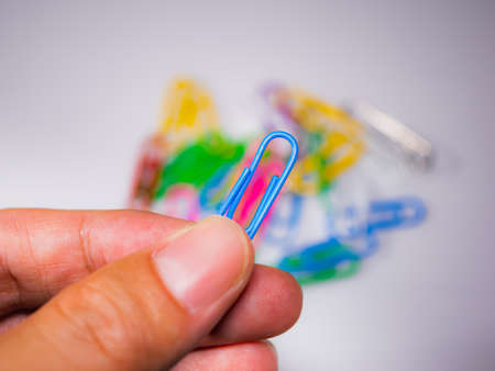 picked up blue paper clipの写真素材