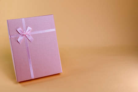 pink gift box To be given to each other in various festivals such as Valentine's Day, Christmas Day, various anniversaries Let's take a photo to see the light and shadow.の写真素材