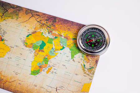 Compass with holiday travel adventure travel map it tells the direction north, south, east, west.の写真素材
