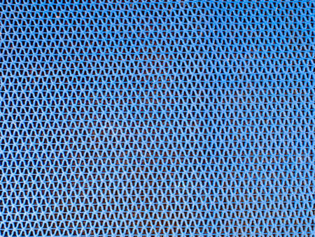 The blue rubber surfaces that cross each other create a pattern. Crabs on the ground, making walking and treading not slippery.の写真素材