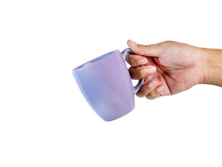 The old purple coffee mug is tilted in his hand, asking for a cup of coffee or a hot drink.の写真素材