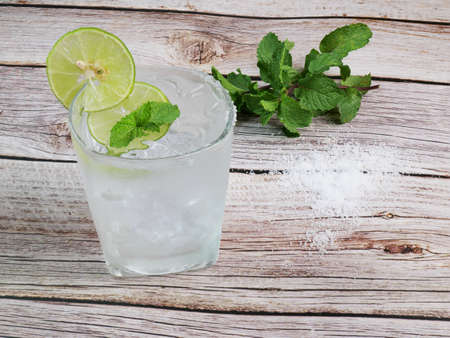 lemon soda cold drink Lemon juice with soda on ice Garnished with sliced lemons to garnish. Apply lemon juice and salt to the mouth of the glass. Garnish with mint leaves above. as a drinkの写真素材