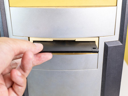 Hold the Floppy A disc and insert the reader. to read and write data It's technology old that have been used for a long time The disc will be less. has a square shape Must press a button to removeの写真素材