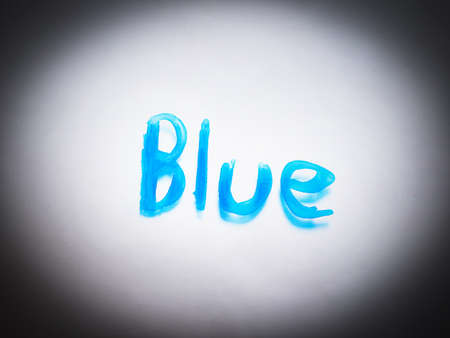 The letter is written BLUE in blue ink. to shine as a highlight in the middle to lighten the dark edgesの写真素材
