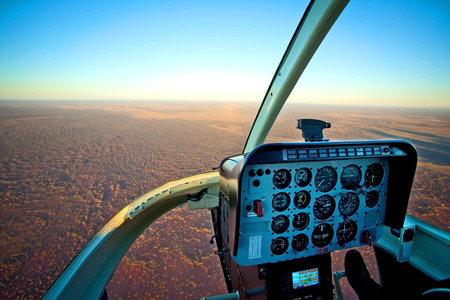 Helicopter Cockpit Flying over Desert Outback Australiaの写真素材