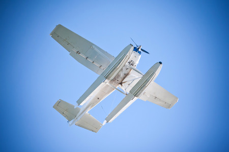 Sea Float Plane Flying Over Blue Sky