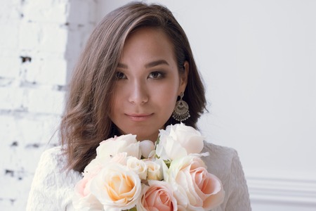Pin-up girl in a white dress with flowers. professional modelの写真素材