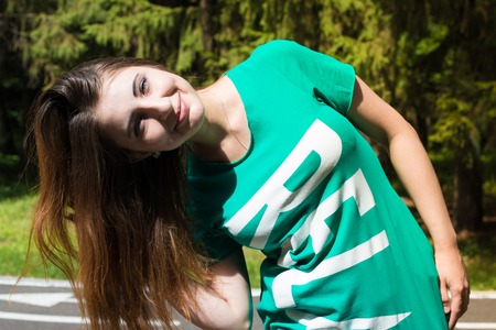 Relax girl hair straightens in the Park. Summer,の写真素材