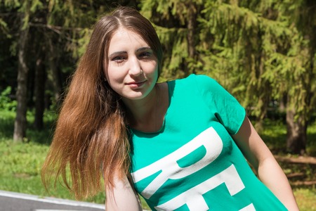 Relax girl hair straightens in the Park. Summer,の写真素材