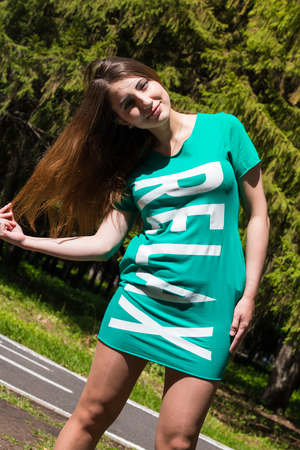 Relax girl hair straightens in the Park. Summer,の写真素材