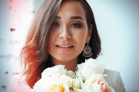 Pin-up girl in a white dress with flowers. professional modelの写真素材