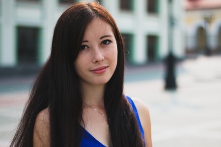 Portrait of a very charming girls in city.の写真素材