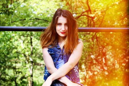 Portrait of a charming girl on the grass.の写真素材