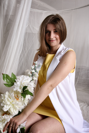 Pretty girl in white, curtainsの写真素材