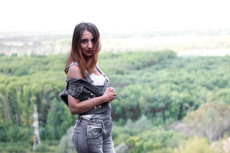 Attractive woman posing against the backdrop of forestの写真素材
