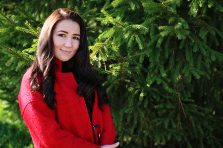 beautiful asian woman in red coatの写真素材