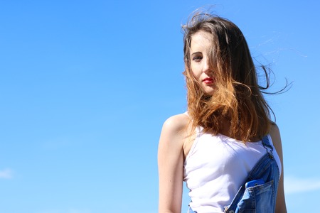 Seductive young woman on a windy dayの写真素材