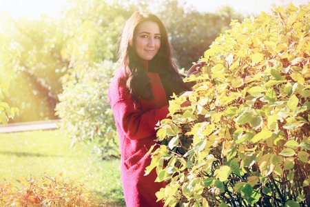 beautiful asian woman in red coatの写真素材