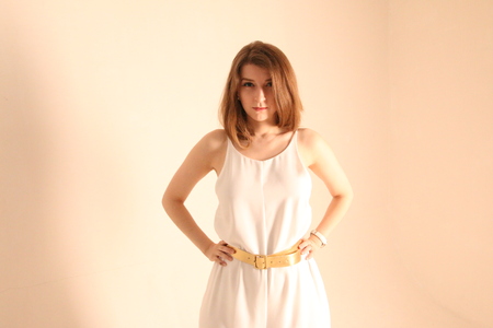 Portrait of caucasian girl with brown hair posing isolated on white backgroundの写真素材
