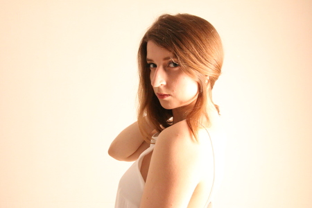 Portrait of caucasian girl with brown hair posing isolated on white backgroundの写真素材