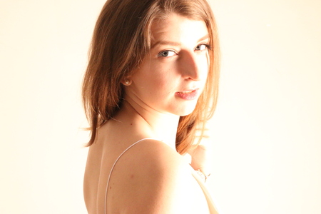 Portrait of caucasian girl with brown hair posing isolated on white backgroundの写真素材