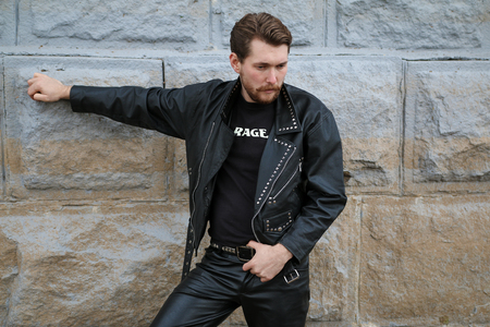 Handsome bearded man in black leather jacketsの写真素材